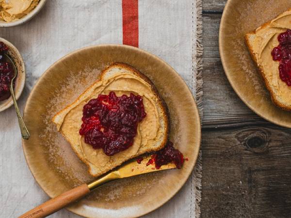 Toast with peanut butter and berry jam